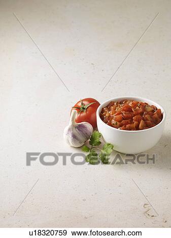 Bowl of salsa with tomato and garlic View Large Photo Image Stock Photo - Bowl of salsa with tomato and garlic. Fotosearch
