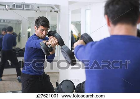 Boxer training with weights in gym View Large Photo Image Stock Image - Boxer training with weights in gym. Fotosearch