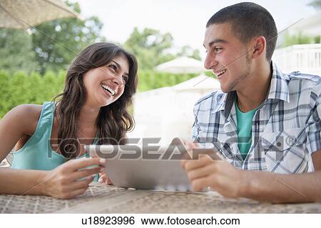 Brother and sister using tablet computer View Large Photo Image Stock Photograph - Brother and sister using tablet computer. Fotosearch