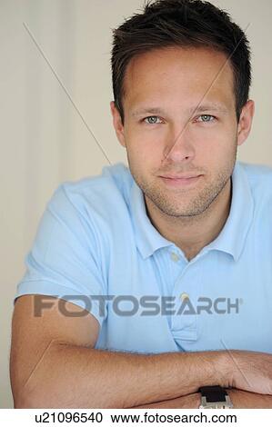 Stock Image - Businessman with arms crossed. Fotosearch