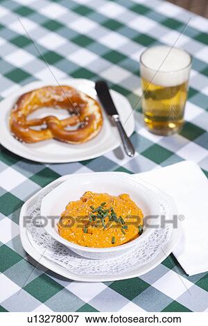 Cheese soup with beer and pretzel View Large Photo Image Stock Photo - Cheese soup with beer and pretzel. Fotosearch