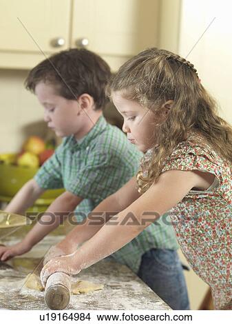 Children baking together in kitchen View Large Photo Image Picture - Children baking together in kitchen. Fotosearch