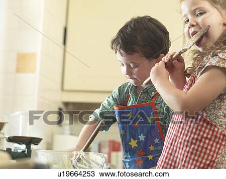 Children baking together in kitchen View Large Photo Image Stock Image - Children baking together in kitchen. Fotosearch