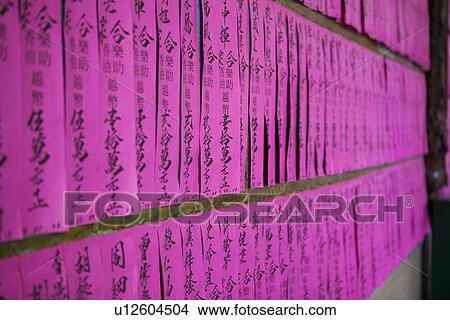 Picture - Chinese lettering on pink papers. Fotosearch