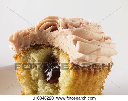 Close up of filled cupcake View Large Photo Image Stock Image - Close up of filled cupcake. Fotosearch