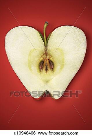 Close up of halved apple View Large Photo Image Stock Photograph - Close up of halved apple. Fotosearch