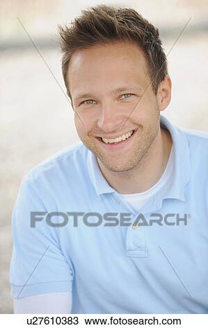 Stock Image - Close up of man’s smiling face. Fotosearch