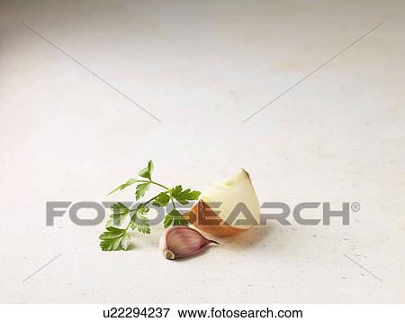 Close up of onion, garlic and parsley View Large Photo Image Stock Photo - Close up of onion, garlic and parsley. Fotosearch