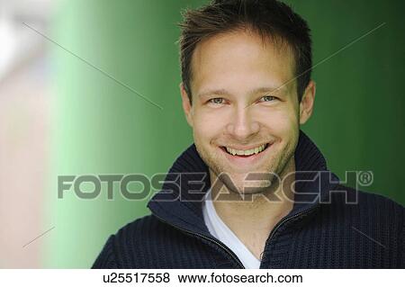 Stock Photo - Close up of smiling man’s face. Fotosearch