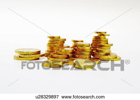 Stock Photo - Close up of stacks of gold coins. Fotosearch