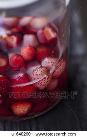 Close up of wild strawberries in sauce View Large Photo Image Stock Image - Close up of wild strawberries in sauce. Fotosearch