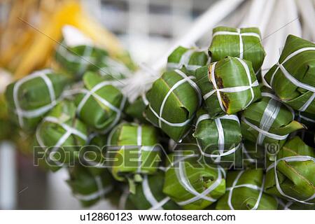 Stock Image - Close up of wrapped fermented meat. Fotosearch