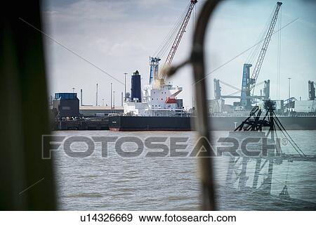 Container ship and cranes in harbor View Large Photo Image Stock Photo - Container ship and cranes in harbor. Fotosearch
