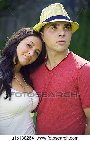 Couple hugging outdoors View Large Photo Image Picture - Couple hugging outdoors. Fotosearch