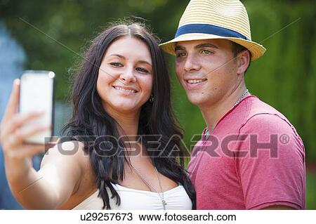 Couple taking picture of themselves View Large Photo Image Stock Image - Couple taking picture of themselves. Fotosearch