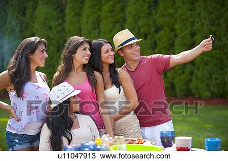 Family taking picture of themselves View Large Photo Image Stock Image - Family taking picture of themselves. Fotosearch