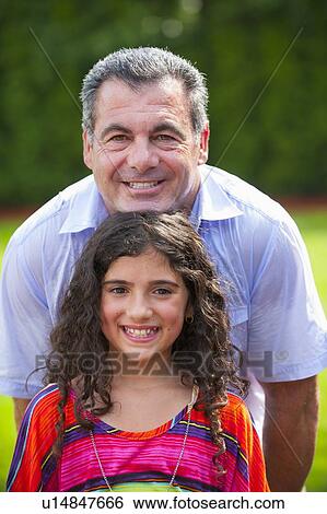 Father and daughter smiling outdoors View Large Photo Image Stock Photograph - Father and daughter smiling outdoors. Fotosearch