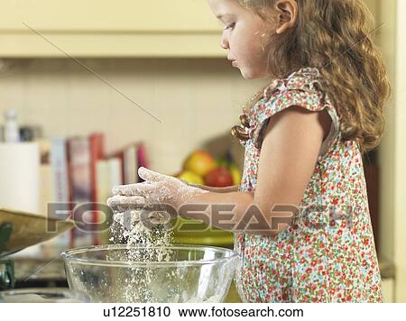 Girl baking in kitchen View Large Photo Image Stock Image - Girl baking in kitchen. Fotosearch