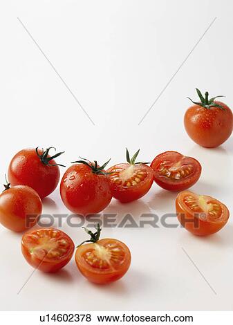 Halved plum tomatoes on kitchen counter View Large Photo Image Stock Photo - Halved plum tomatoes on kitchen counter. Fotosearch