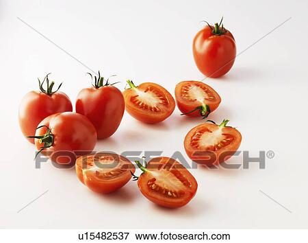 Halved plum tomatoes on kitchen counter View Large Photo Image Stock Photo - Halved plum tomatoes on kitchen counter. Fotosearch