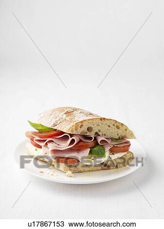 Stock Image - Ham, tomato and cheese sandwich. Fotosearch