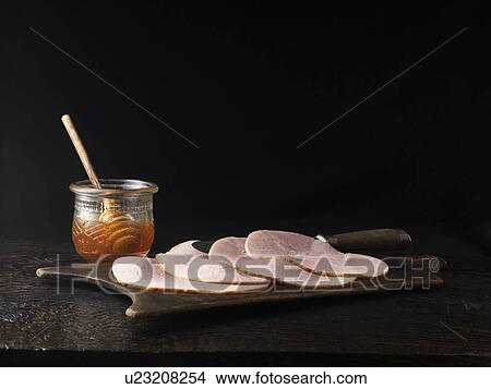 Jar of honey with plate of ham View Large Photo Image Picture - Jar of honey with plate of ham. Fotosearch