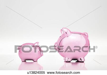 Stock Photography - Large and small piggy banks. Fotosearch