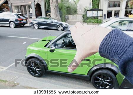 Man pretending to hold car View Large Photo Image Stock Photography - Man pretending to hold car. Fotosearch