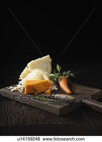 Onion, carrot and cabbage on board View Large Photo Image Stock Photo - Onion, carrot and cabbage on board. Fotosearch