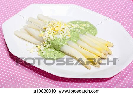 Plate of asparagus in sauce View Large Photo Image Stock Image - Plate of asparagus in sauce. Fotosearch