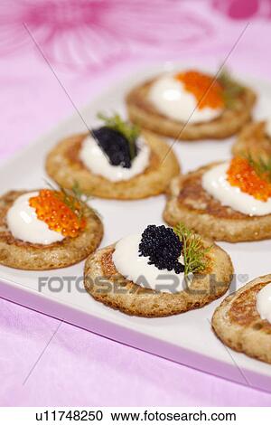 Plate of blini with cheese and caviar View Large Photo Image Stock Image - Plate of blini with cheese and caviar. Fotosearch
