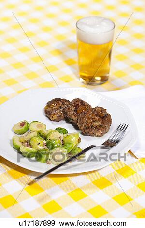Plate of dumplings and brussels sprouts View Large Photo Image Stock Photo - Plate of dumplings and brussels sprouts. Fotosearch