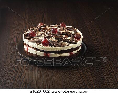 Stock Image - Plate of forest gateau cake. Fotosearch