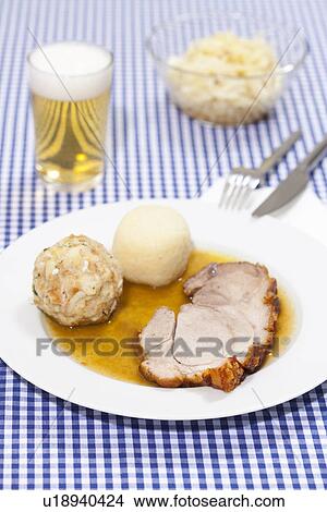 Plate of roast pork with dumplings View Large Photo Image Picture - Plate of roast pork with dumplings. Fotosearch