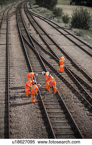 Stock Photography - Railway workers examining train tracks. Fotosearch