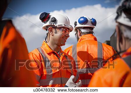 Railway workers talking outdoors View Large Photo Image Stock Image - Railway workers talking outdoors. Fotosearch