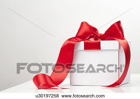 Red ribbon on gift box View Large Photo Image Stock Photo - Red ribbon on gift box. Fotosearch