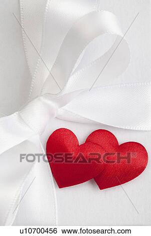 Stock Photograph - Satin hearts on gift box. Fotosearch