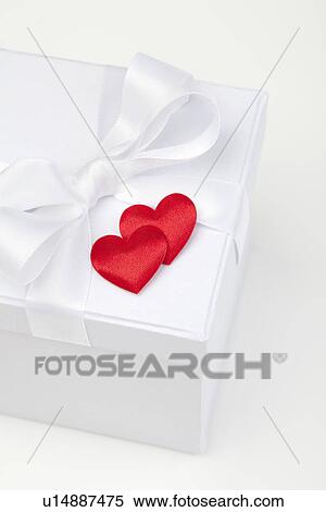 Satin hearts on gift box View Large Photo Image Stock Photography - Satin hearts on gift box. Fotosearch