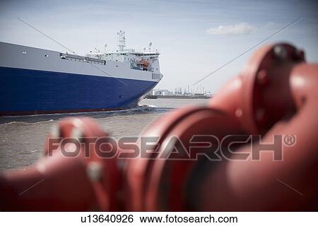 Stock Photograph - Ship viewed from behind pipes. Fotosearch