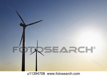 Stock Photo - Silhouettes of wind turbines. Fotosearch