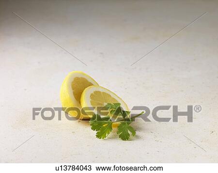 Sliced lemon and coriander View Large Photo Image Stock Image - Sliced lemon and coriander. Fotosearch