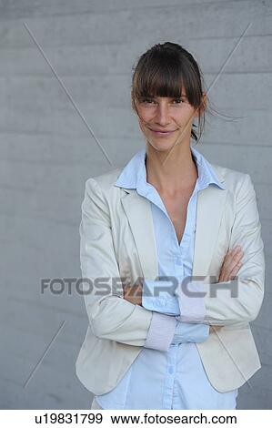 Smiling businesswoman with crossed arms View Large Photo Image Stock Photo - Smiling businesswoman with crossed arms. Fotosearch