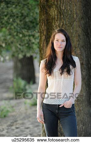 Stock Photography - Smiling woman standing outdoors. Fotosearch