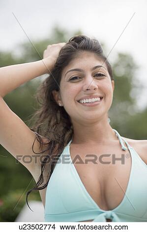 Smiling woman wearing bikini outdoors View Large Photo Image Picture - Smiling woman wearing bikini outdoors. Fotosearch