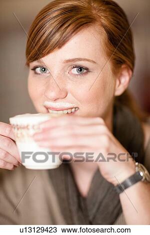 Smiling woman with milk mustache View Large Photo Image Stock Image - Smiling woman with milk mustache. Fotosearch