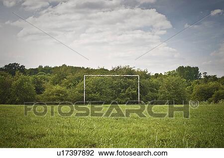 Stock Image - Soccer goal on grassy pitch. Fotosearch