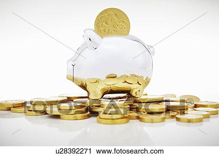 Stack of gold coins by piggy bank View Large Photo Image Stock Image - Stack of gold coins by piggy bank. Fotosearch