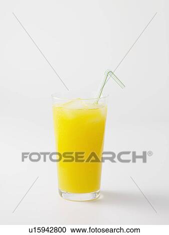 Stock Image - Straw in glass of orange juice. Fotosearch