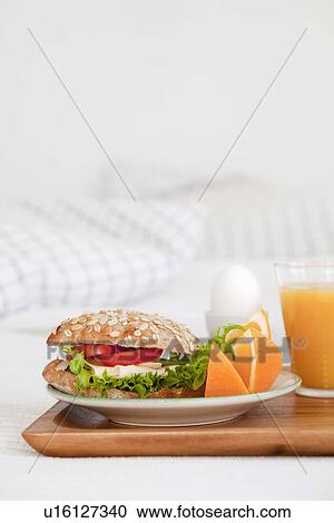 Tray of breakfast food on bed View Large Photo Image Stock Image - Tray of breakfast food on bed. Fotosearch